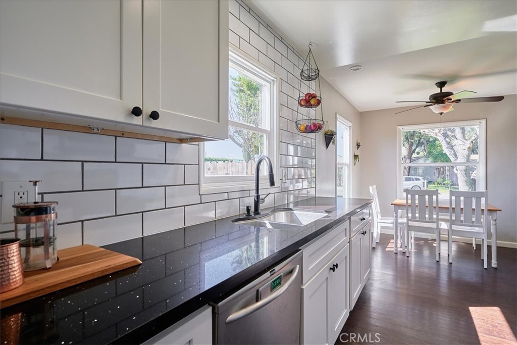 3469 Verde Street Riverside, CA 92504 - Photo 16 of 38 a kitchen with granite countertop a sink a stove and cabinets