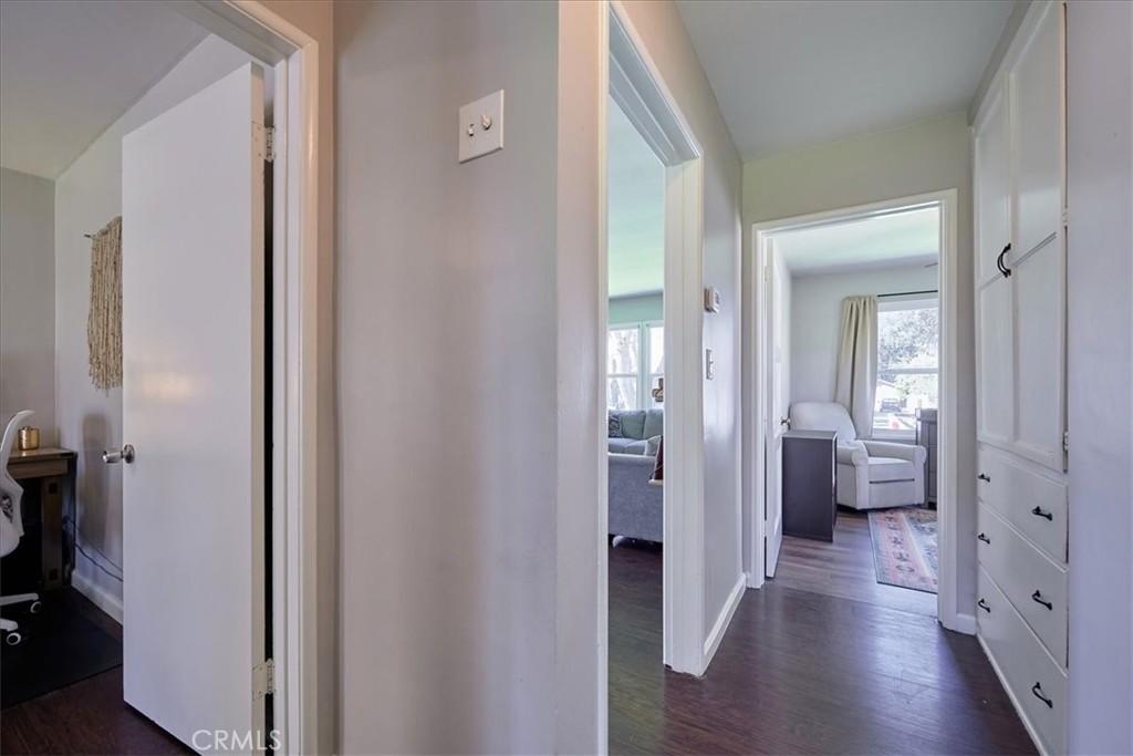 3469 Verde Street Riverside, CA 92504 - Photo 18 of 38 a view of a hallway with wooden floor and a bedroom