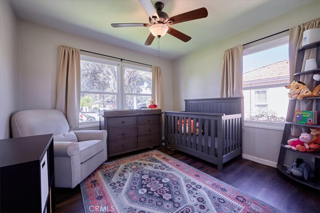 3469 Verde Street Riverside, CA 92504 - Photo 19 of 38 a bedroom with a bed and a chandelier