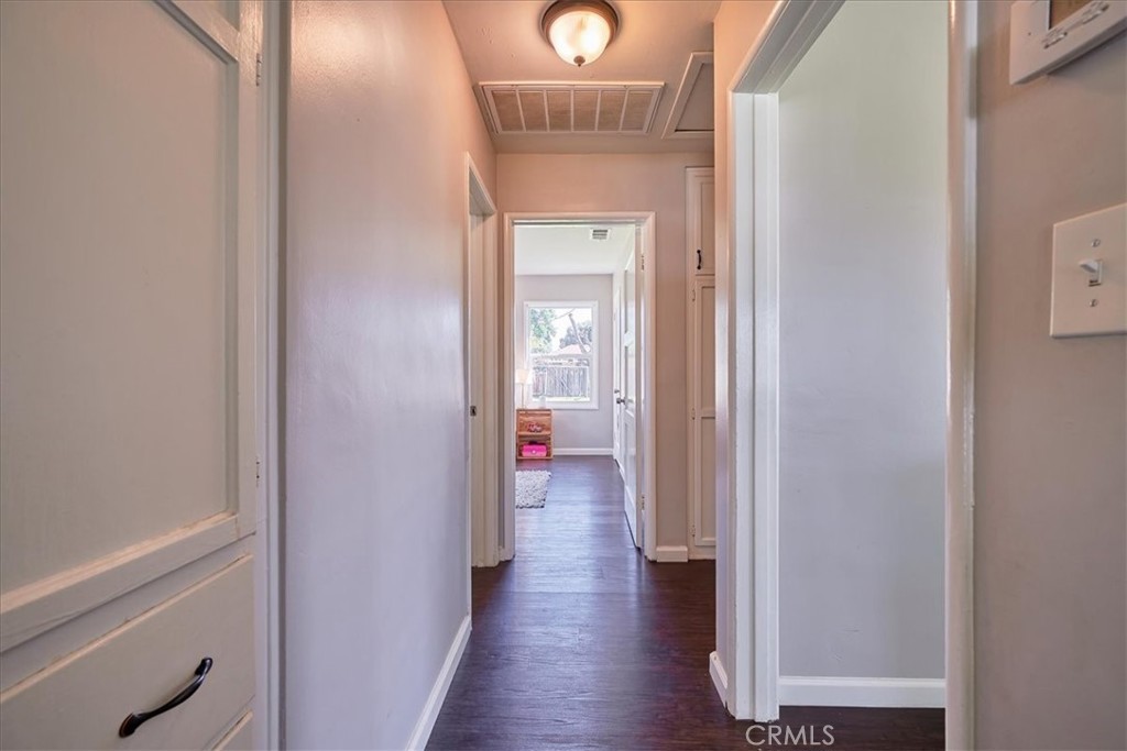 3469 Verde Street Riverside, CA 92504 - Photo 21 of 38 a view of a hallway with wooden floor