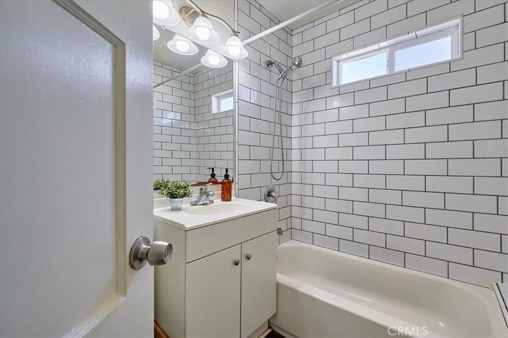 3469 Verde Street Riverside, CA 92504 - Photo 22 of 38 a bathroom with a sink a bathtub and shower