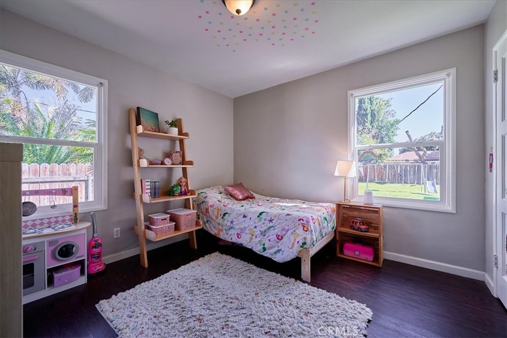 3469 Verde Street Riverside, CA 92504 - Photo 23 of 38 a bedroom with a bed and a window