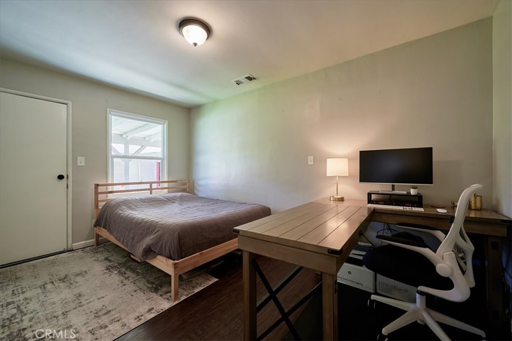 3469 Verde Street Riverside, CA 92504 - Photo 25 of 38 a bedroom with a bed and a flat screen tv