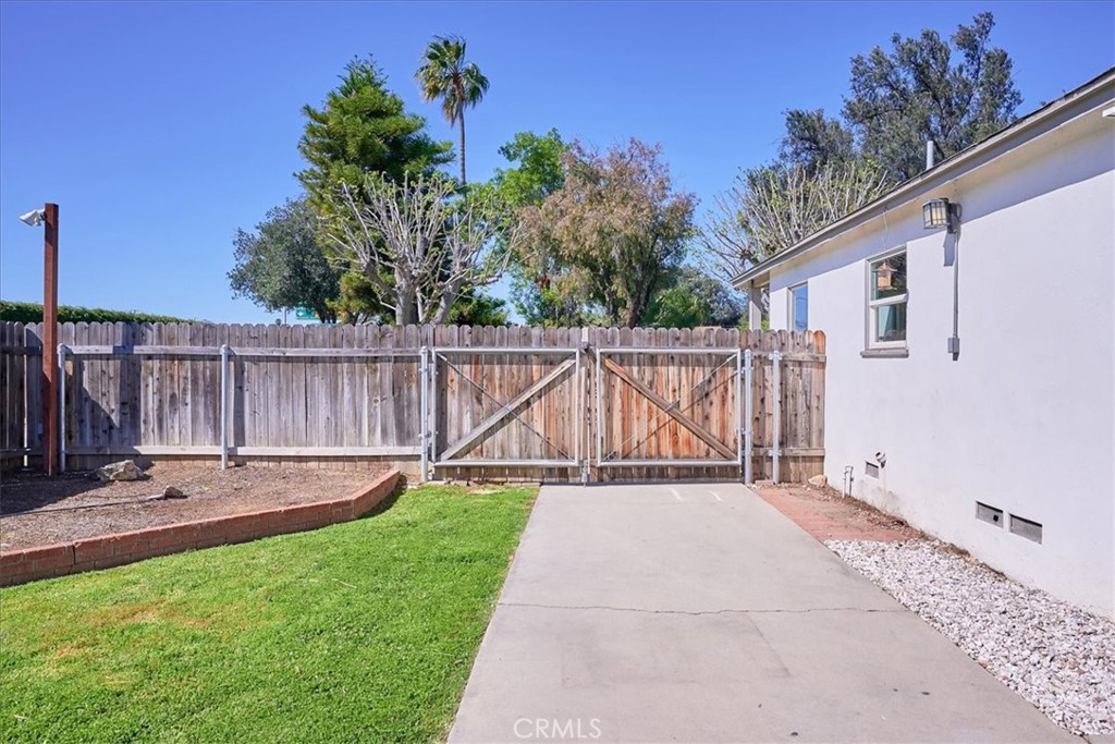 3469 Verde Street Riverside, CA 92504 - Photo 31 of 38 a view of a backyard with wooden fence