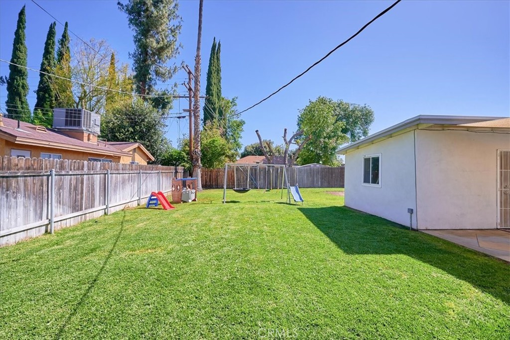 3469 Verde Street Riverside, CA 92504 - Photo 36 of 38 a view of a backyard with plants and wooden fence
