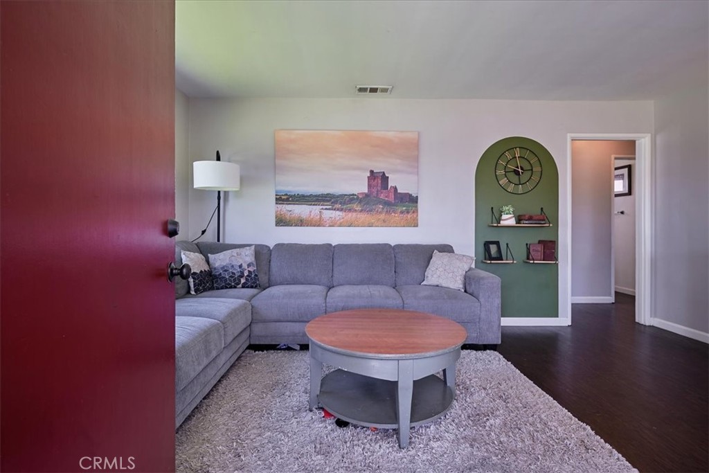 3469 Verde Street Riverside, CA 92504 - Photo 8 of 38 a living room with furniture and a wooden floor