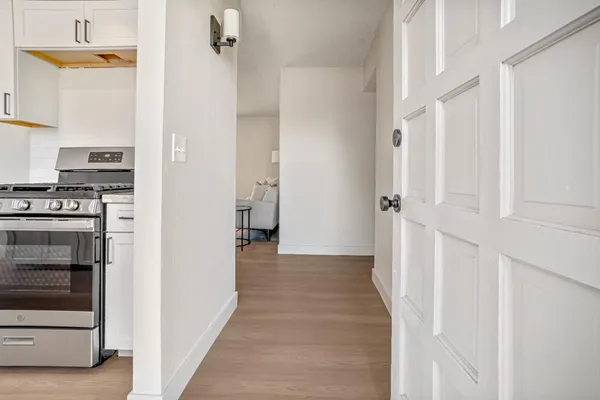 a view of a kitchen from the hallway