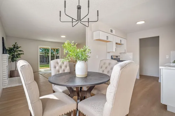 a view of a dining room with furniture and wooden floor