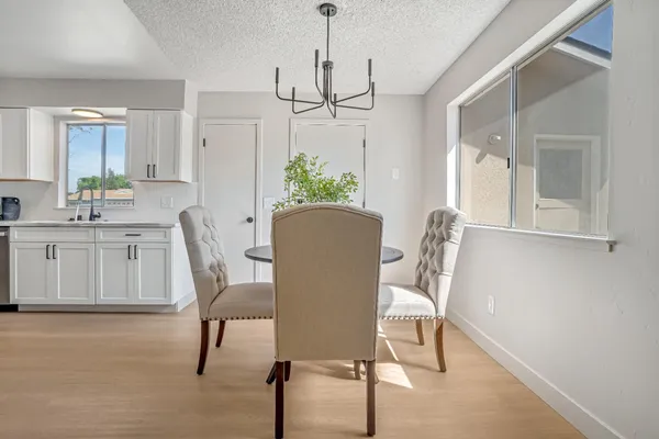 a dining room with furniture and window