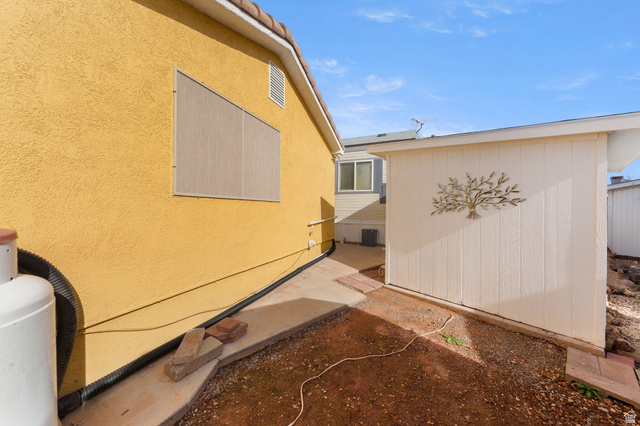 1225 North Dixie Downs Road, Unit 161 St. George, UT 84770 - Photo 19 of 21 Exterior stucco finish in a warm tone, featuring a terracotta tile roof line
