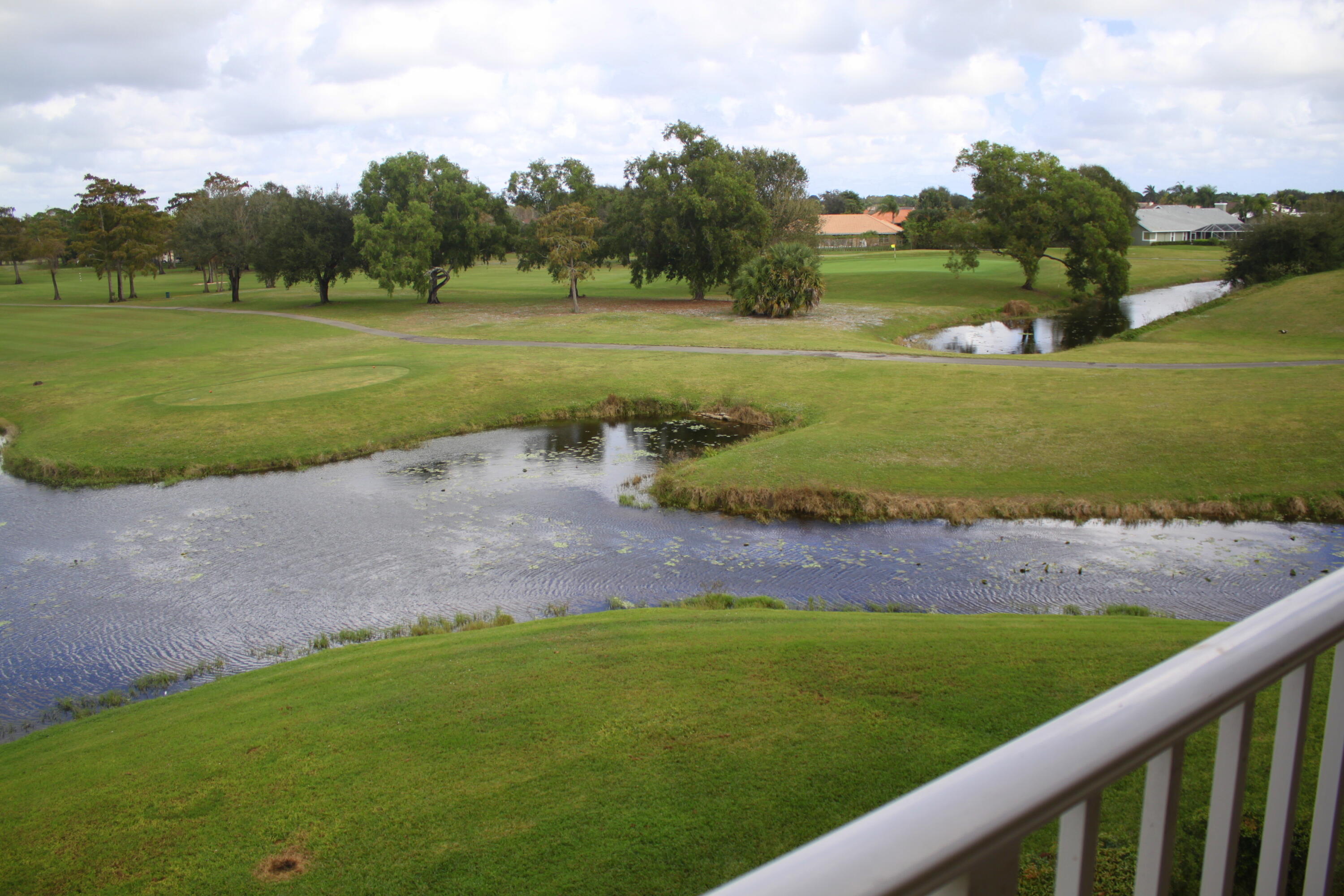 a view of a golf course with a yard