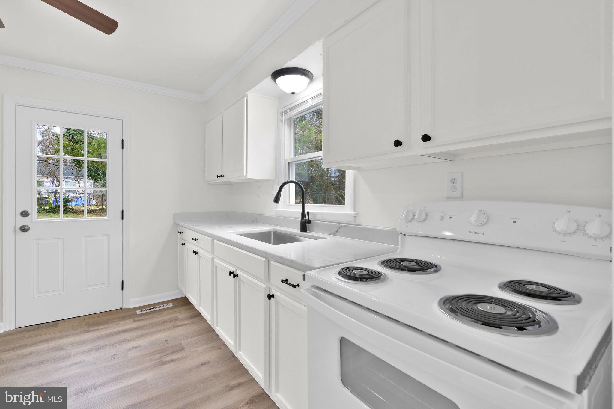 46423 Franklin Road Lexington Park, MD 20653 - Photo 11 of 25 a kitchen with a stove a sink and a window