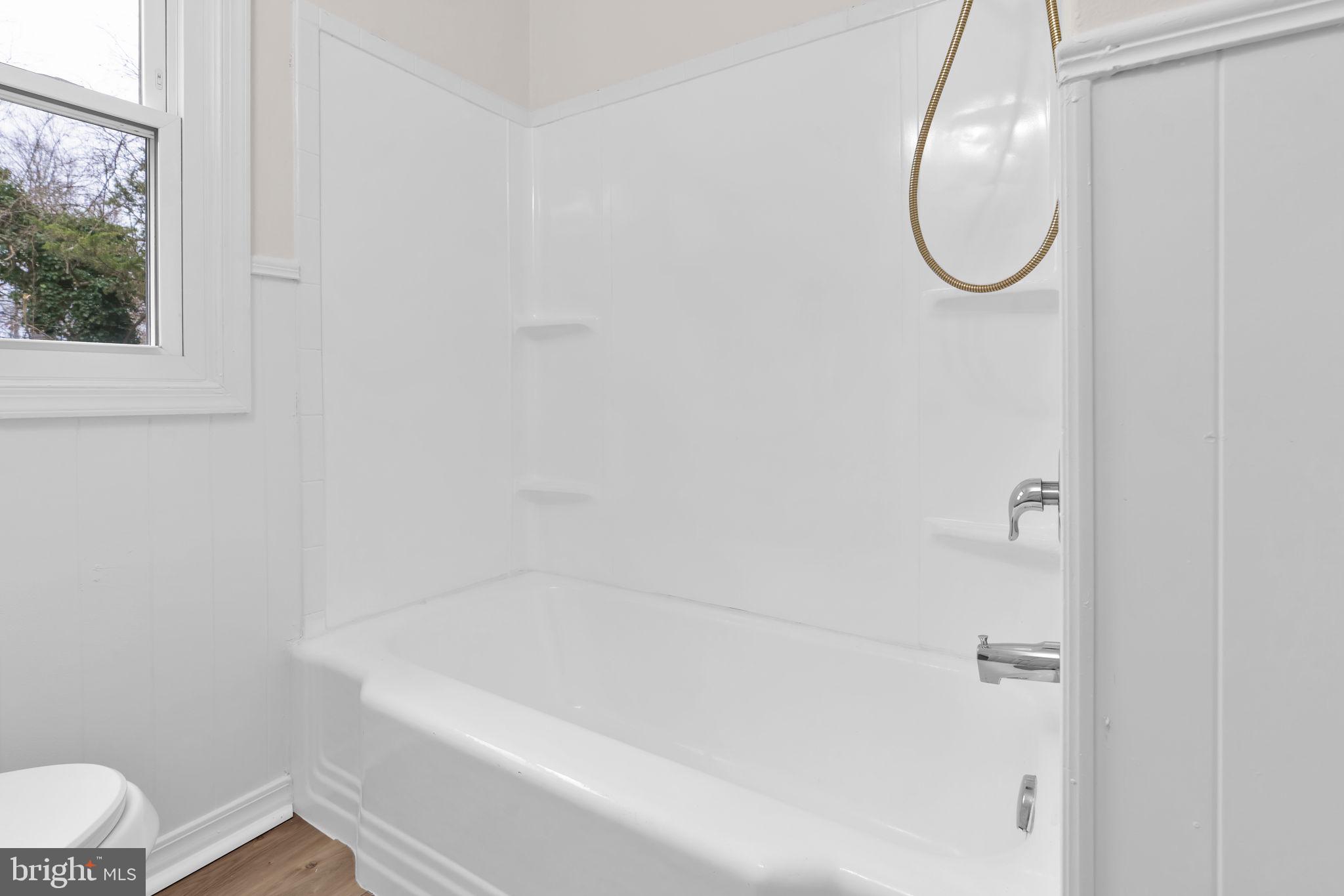 46423 Franklin Road Lexington Park, MD 20653 - Photo 20 of 25 a bathroom with a white bath tub and a shower