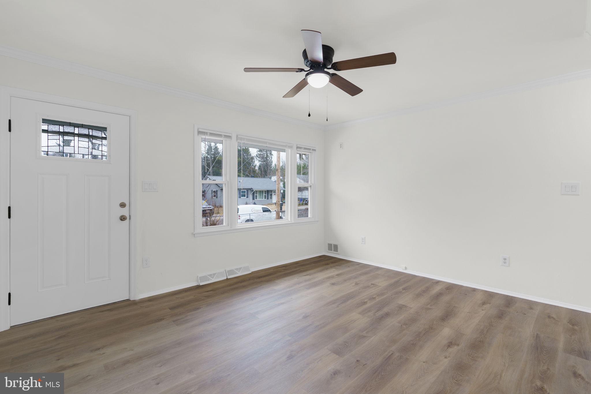 46423 Franklin Road Lexington Park, MD 20653 - Photo 5 of 25 a view of room with hardwood floor and a ceiling fan