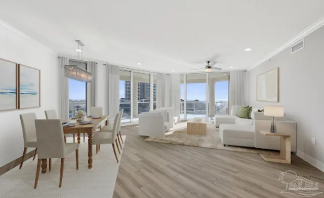 a living room with furniture wooden floor and a large window