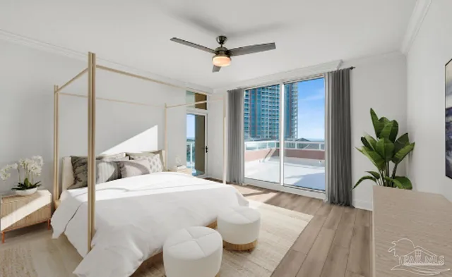 a bedroom with a bed and a large window