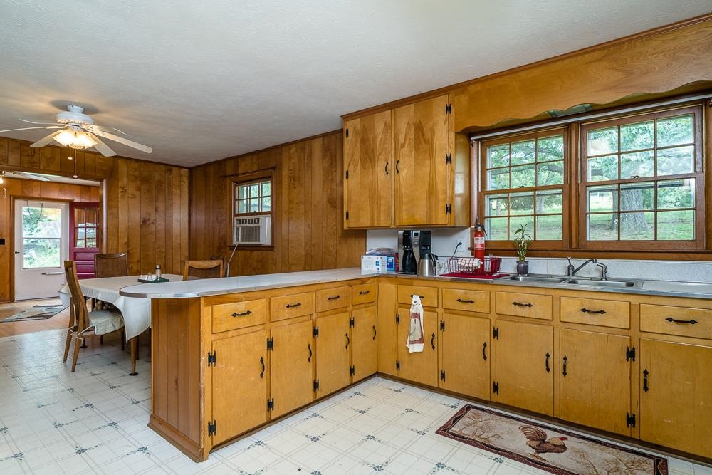 289 Pleasant View Road Staunton, VA 24401 - Photo 8 of 45 a kitchen with sink cabinets and dining table chair