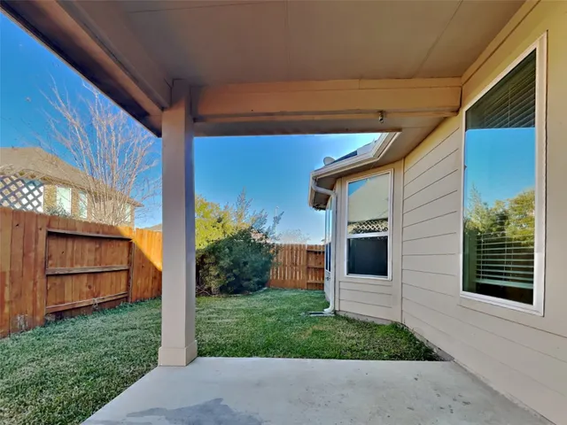 a view of a back yard of the house