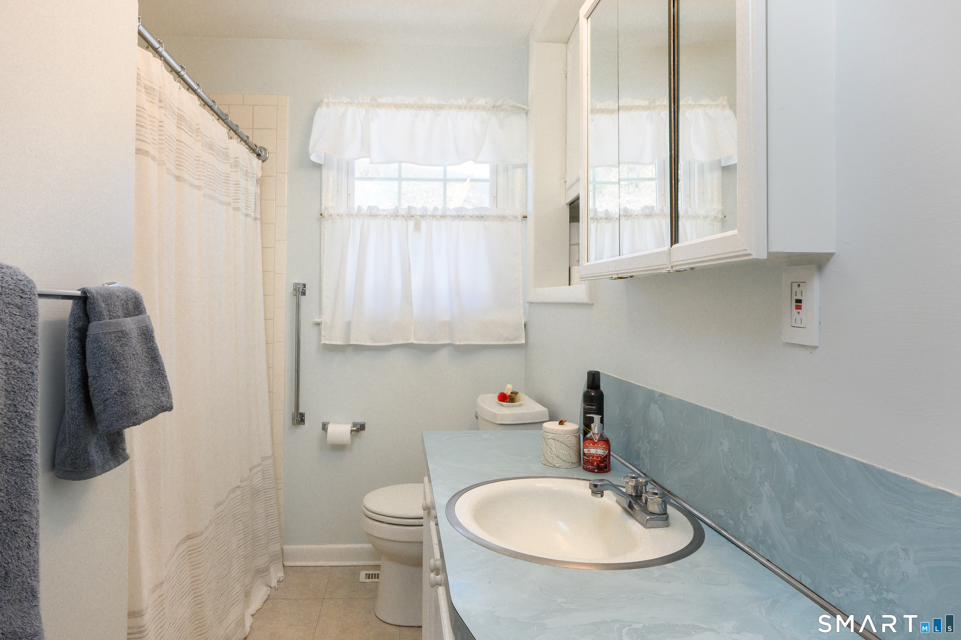76 South Kent Road Kent, CT 06757 - Photo 9 of 20 a bathroom with a sink a toilet and a mirror