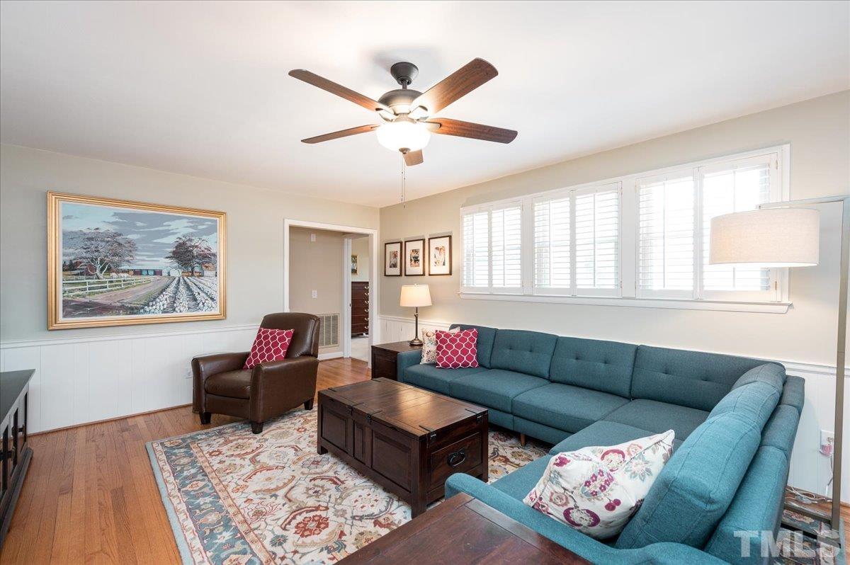 3426 Redbud Lane Raleigh, NC 27607 - Photo 11 of 30 a living room with furniture ceiling fan and a window