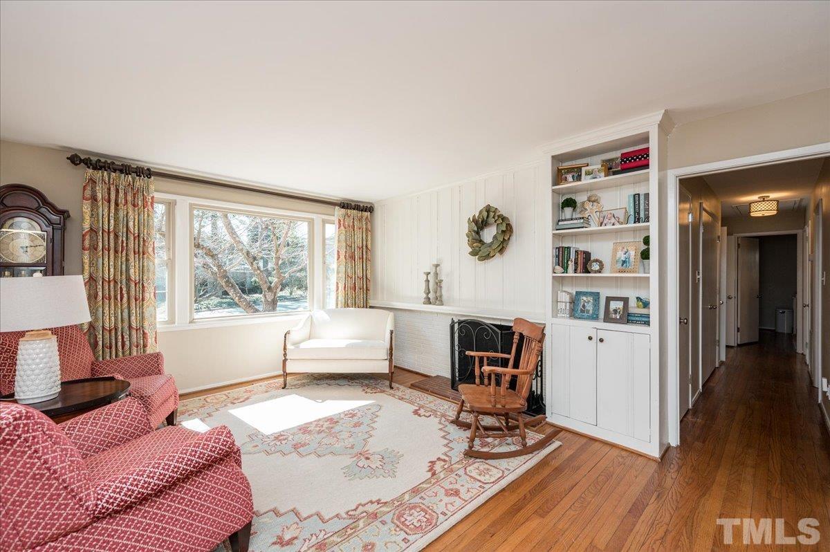 3426 Redbud Lane Raleigh, NC 27607 - Photo 14 of 30 a living room with furniture and a wooden floor