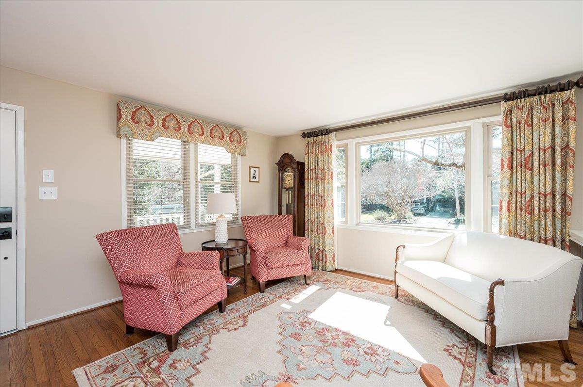 3426 Redbud Lane Raleigh, NC 27607 - Photo 15 of 30 a living room with furniture and a large window