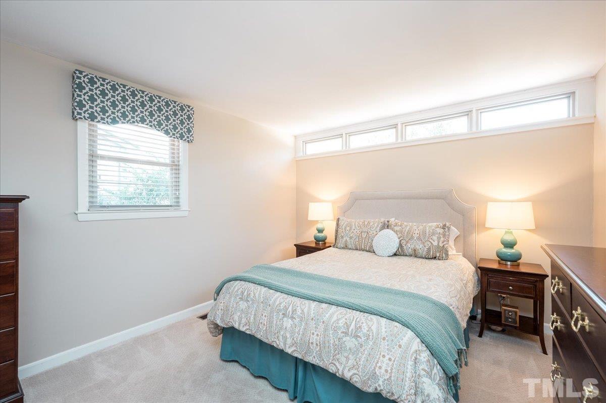 3426 Redbud Lane Raleigh, NC 27607 - Photo 17 of 30 a bedroom with a bed and a window