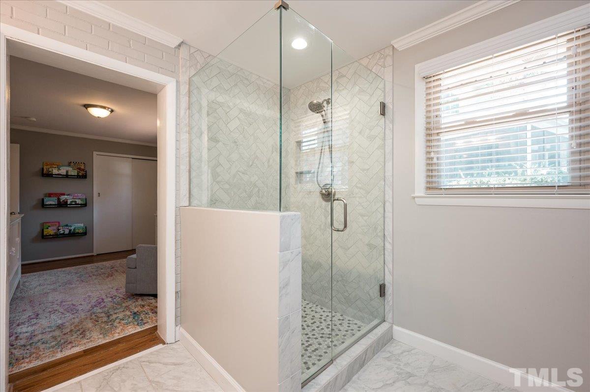 3426 Redbud Lane Raleigh, NC 27607 - Photo 19 of 30 a bathroom with a shower and a sink