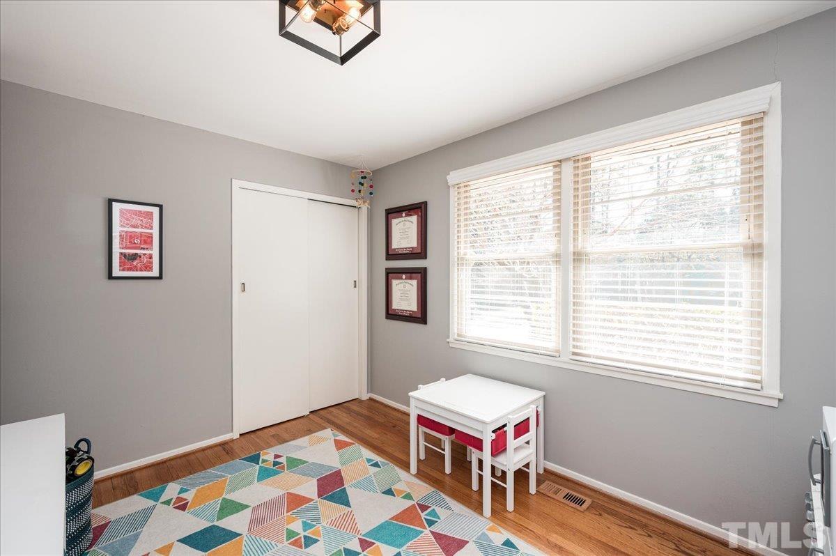 3426 Redbud Lane Raleigh, NC 27607 - Photo 23 of 30 a bedroom with bed and a window