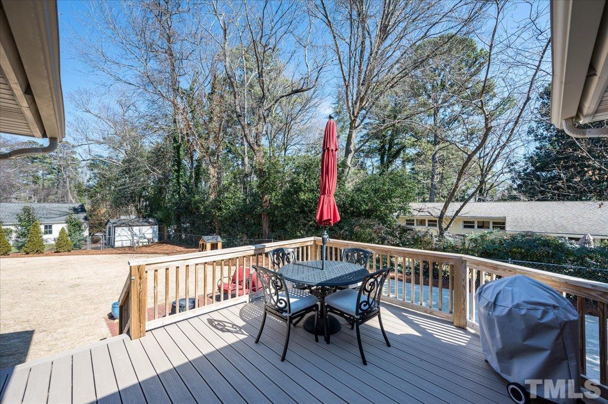 3426 Redbud Lane Raleigh, NC 27607 - Photo 24 of 30 a view of a wooden deck with furniture