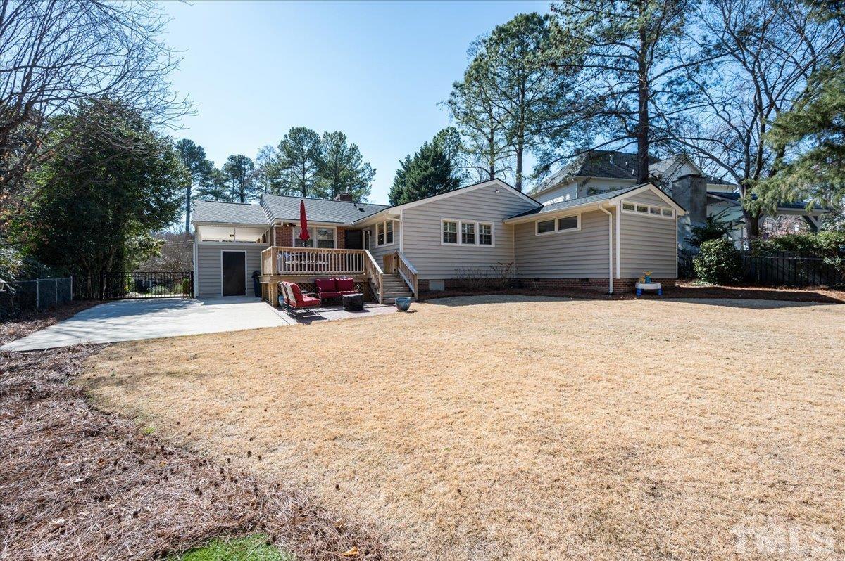 3426 Redbud Lane Raleigh, NC 27607 - Photo 27 of 30 a house with trees in front of it