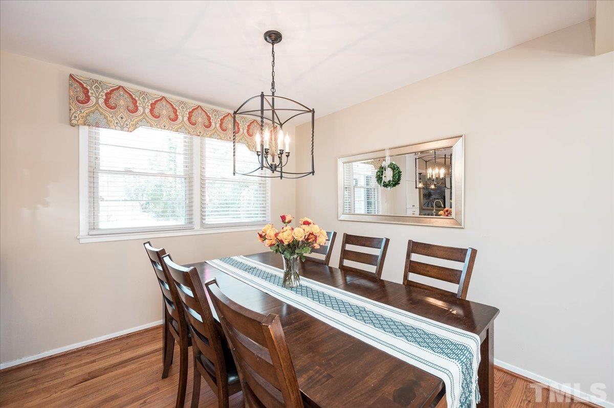 3426 Redbud Lane Raleigh, NC 27607 - Photo 6 of 30 a view of a dining room with furniture window and wooden floor