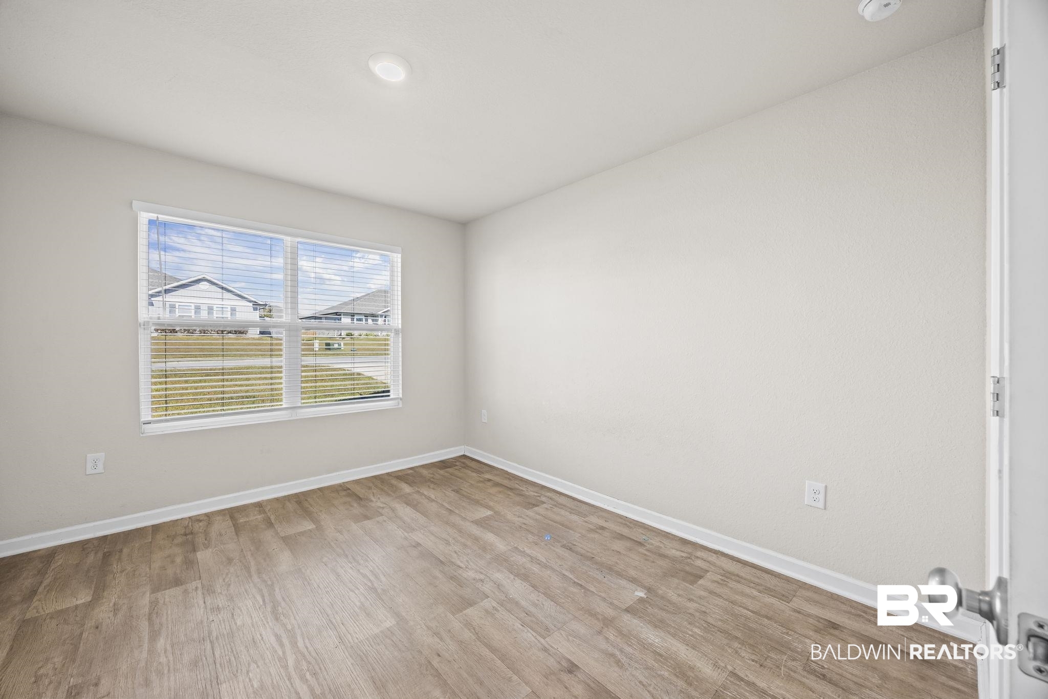 3090 Camino Real Loop Lillian, AL 36549 - Photo 23 of 29 Spare room featuring light wood-style floors and recessed lighting