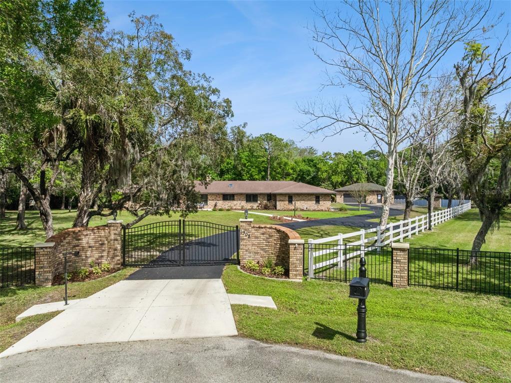 1908 Poppy Lane Port Orange, FL 32128 - Photo 1 of 43 a front view of a house with a yard