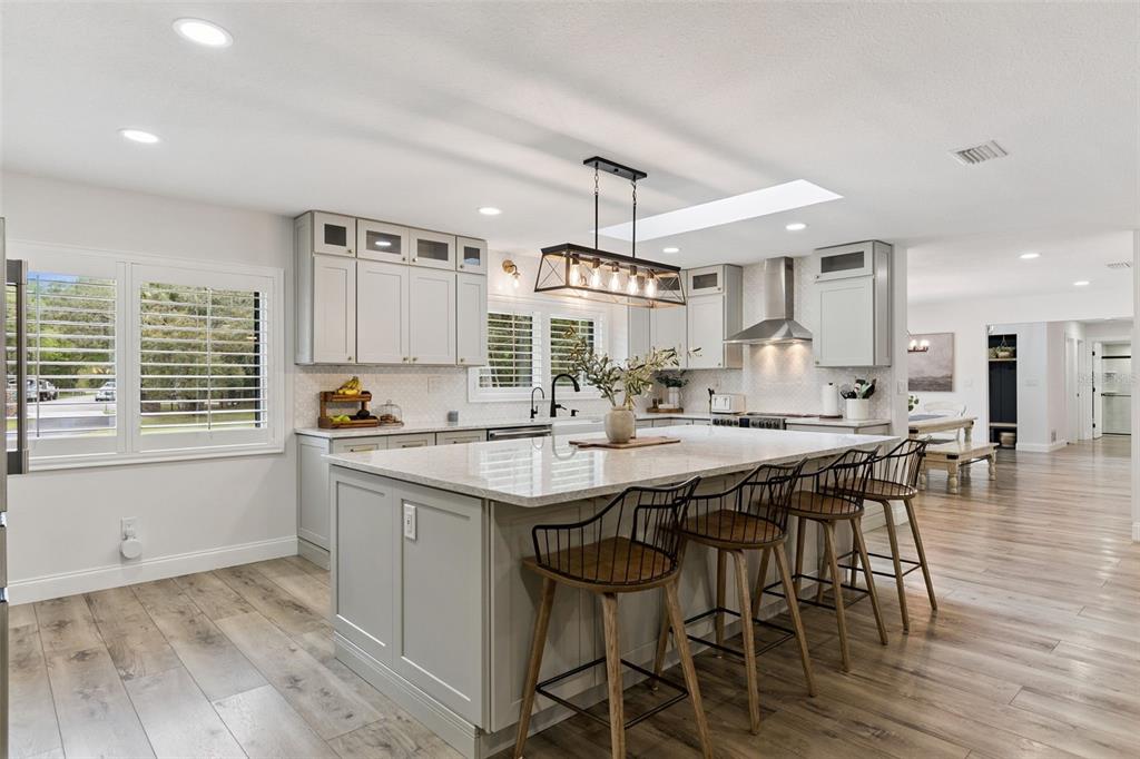 1908 Poppy Lane Port Orange, FL 32128 - Photo 11 of 43 a kitchen with a sink and chairs