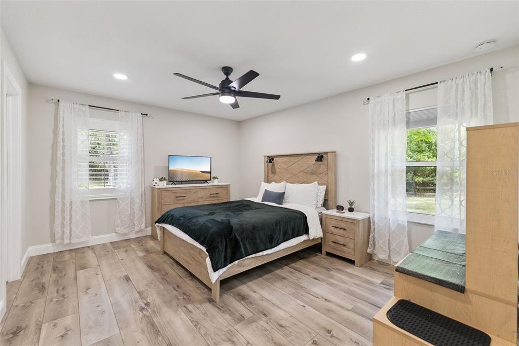 1908 Poppy Lane Port Orange, FL 32128 - Photo 19 of 43 a bedroom with a bed and wooden floor