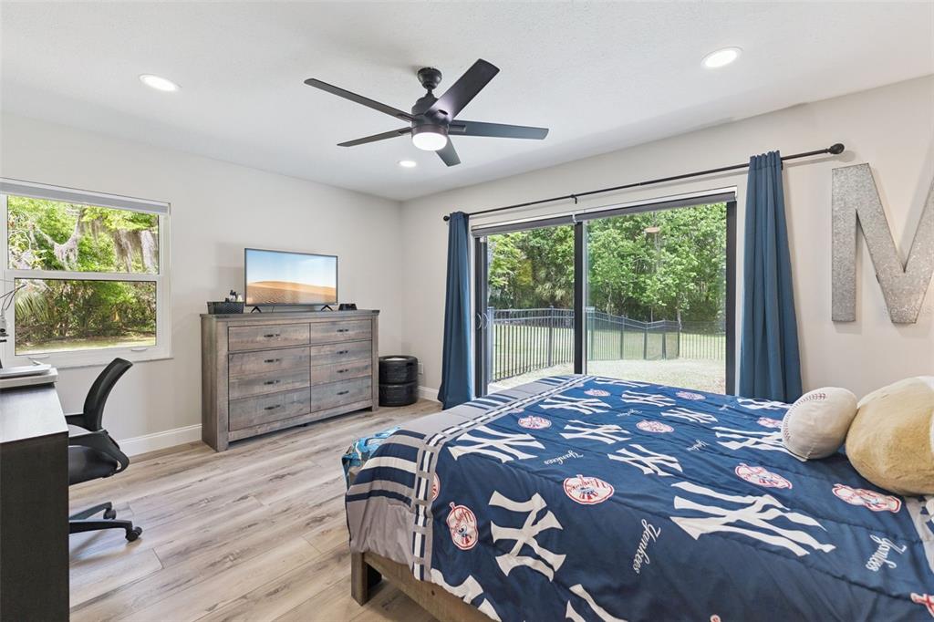 1908 Poppy Lane Port Orange, FL 32128 - Photo 20 of 43 a bedroom with a bed window and a desk