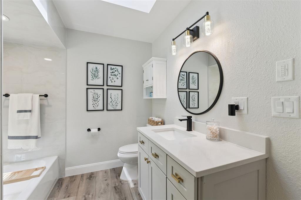 1908 Poppy Lane Port Orange, FL 32128 - Photo 22 of 43 a bathroom with a sink and a mirror