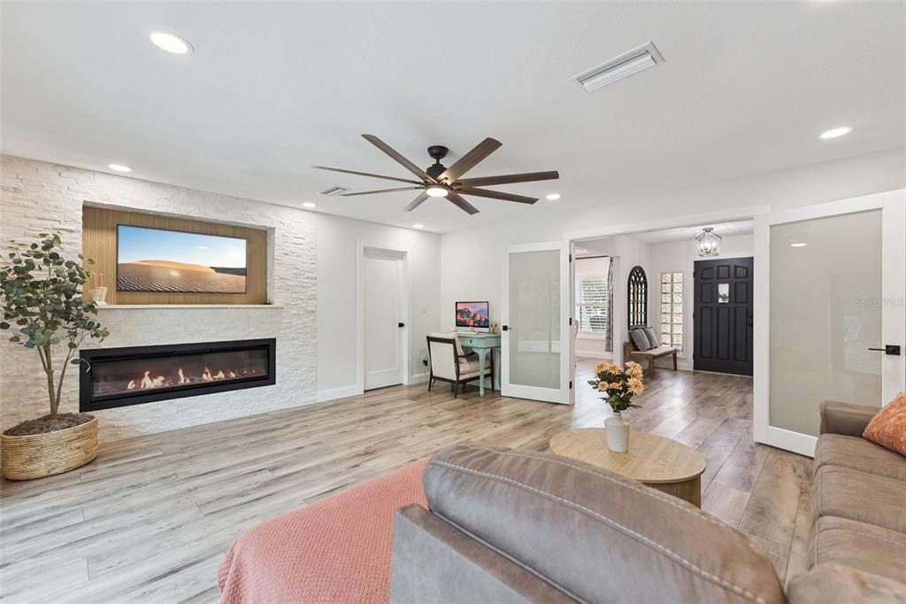 1908 Poppy Lane Port Orange, FL 32128 - Photo 24 of 43 a living room with furniture and a fireplace