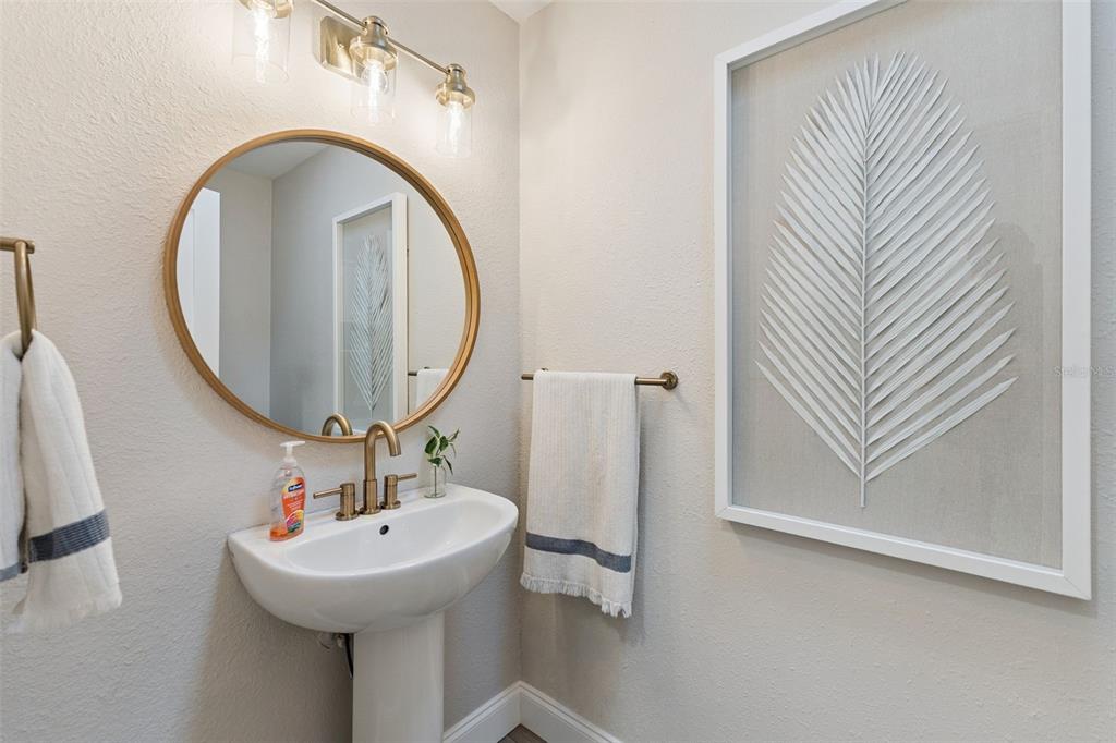 1908 Poppy Lane Port Orange, FL 32128 - Photo 25 of 43 a bathroom with a sink and a mirror