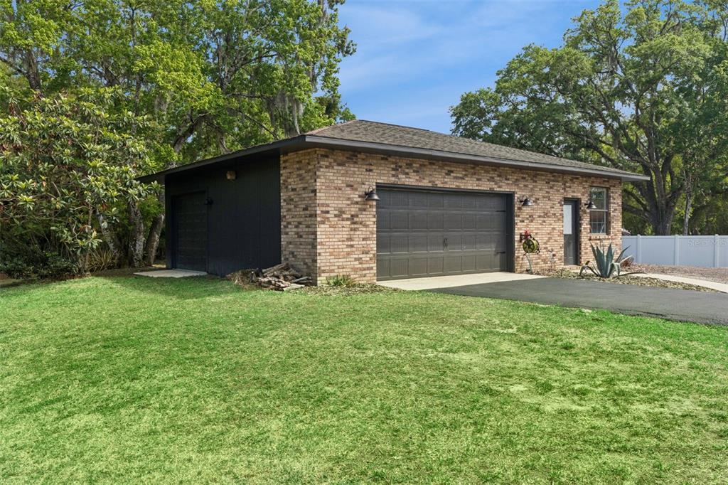 1908 Poppy Lane Port Orange, FL 32128 - Photo 32 of 43 a front view of a house with a yard