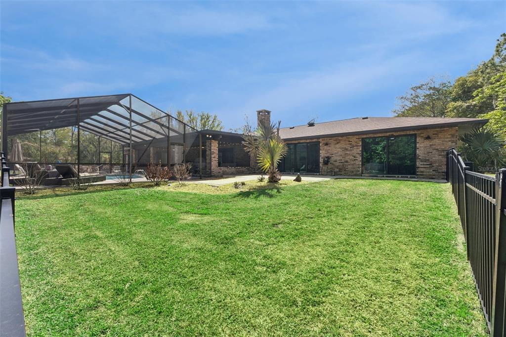 1908 Poppy Lane Port Orange, FL 32128 - Photo 35 of 43 a view of a house with a yard porch and sitting area