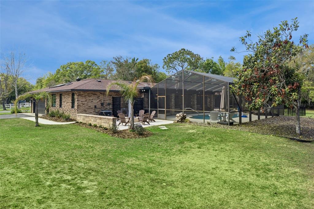 1908 Poppy Lane Port Orange, FL 32128 - Photo 37 of 43 a front view of a house with yard patio and green space