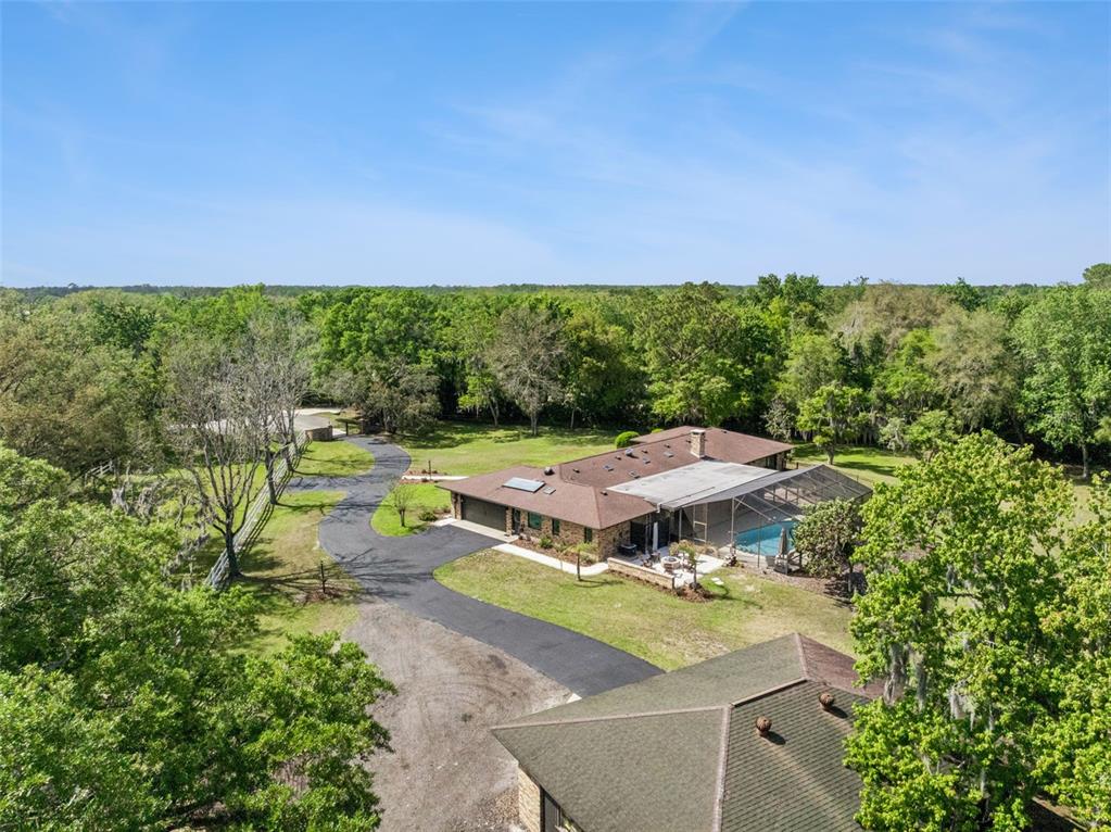 1908 Poppy Lane Port Orange, FL 32128 - Photo 41 of 43 an aerial view of a house with a garden and outdoor space