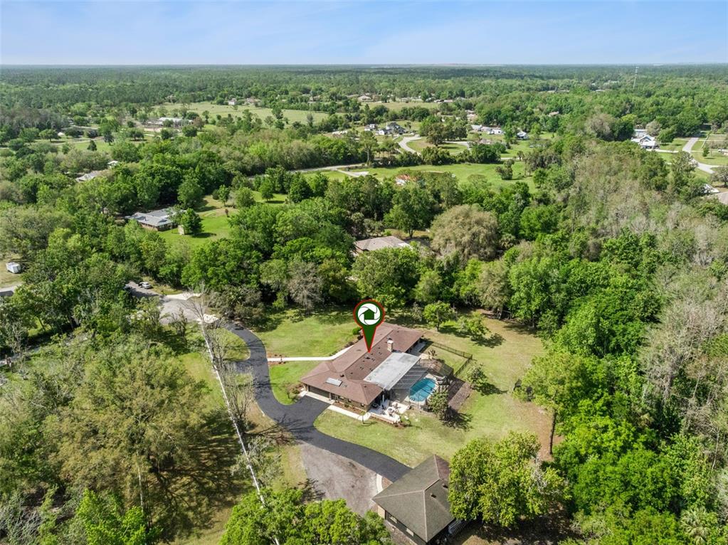 1908 Poppy Lane Port Orange, FL 32128 - Photo 43 of 43 an aerial view of a house with a yard