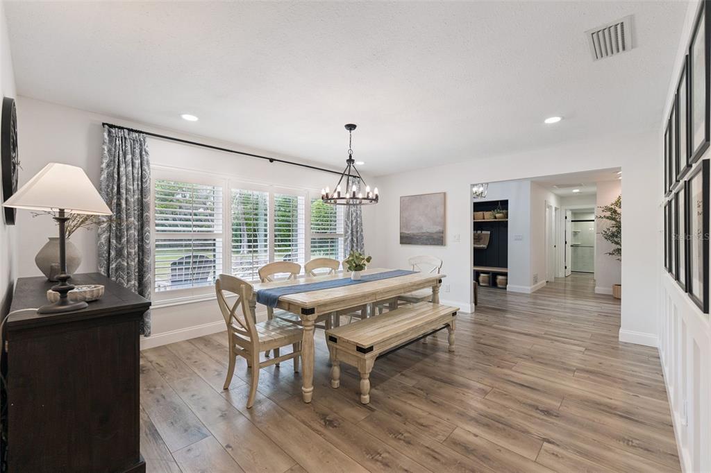 1908 Poppy Lane Port Orange, FL 32128 - Photo 7 of 43 a view of a dining room with furniture window and wooden floor