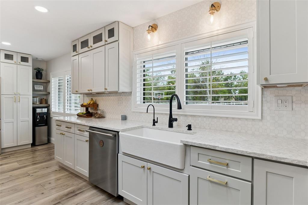1908 Poppy Lane Port Orange, FL 32128 - Photo 9 of 43 a kitchen with appliances cabinets and a sink