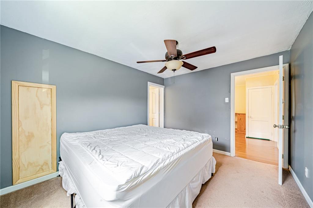 135 Elrico Road Slickville, PA 15684 - Photo 13 of 22 a bedroom with a large bed and a window