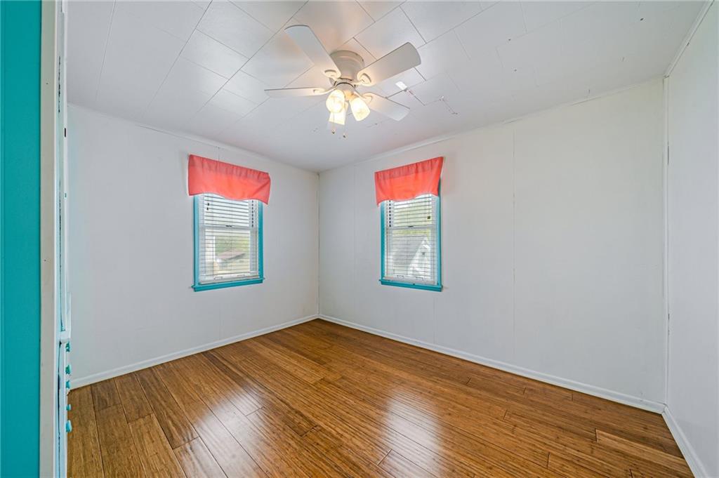 135 Elrico Road Slickville, PA 15684 - Photo 15 of 22 wooden floor in an empty room with a window