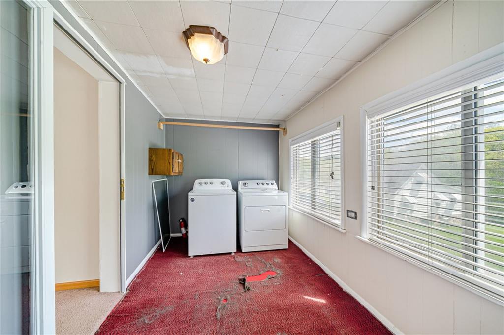 135 Elrico Road Slickville, PA 15684 - Photo 18 of 22 a view of a hallway with a washer and dryer